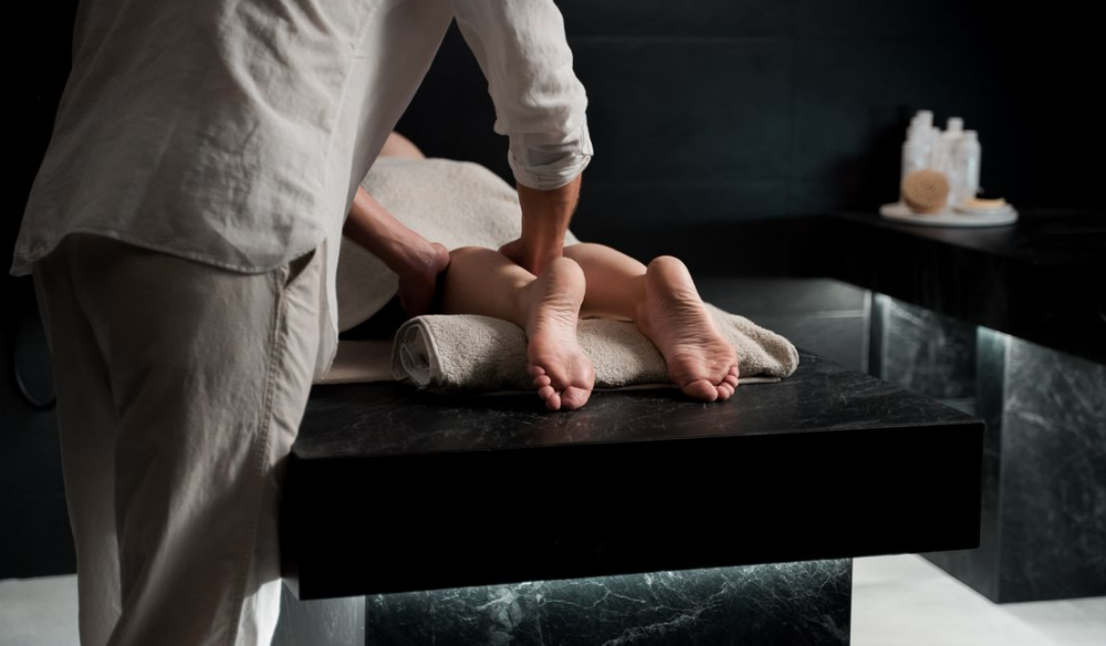 Massage therapist working on a client's feet