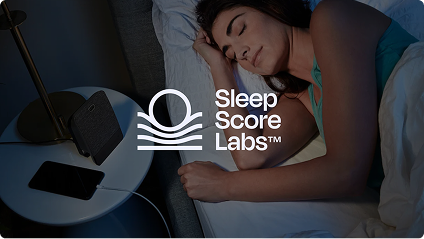 Woman sleeping beside a phone, with the Sleep Score Labs logo