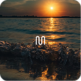 Rest & Release playlist artwork, sunlit waves at dusk