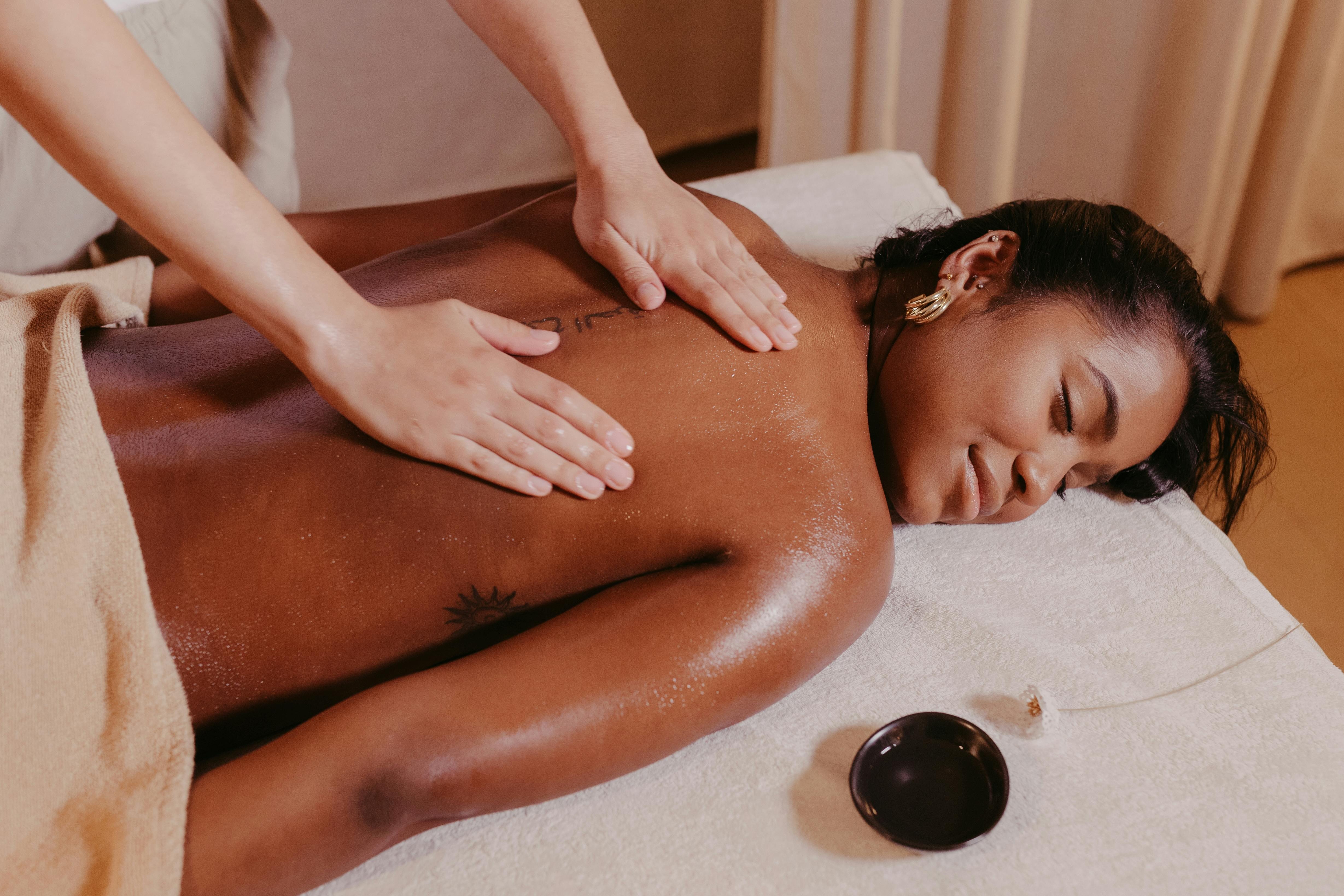 Hot stone back massage in progress