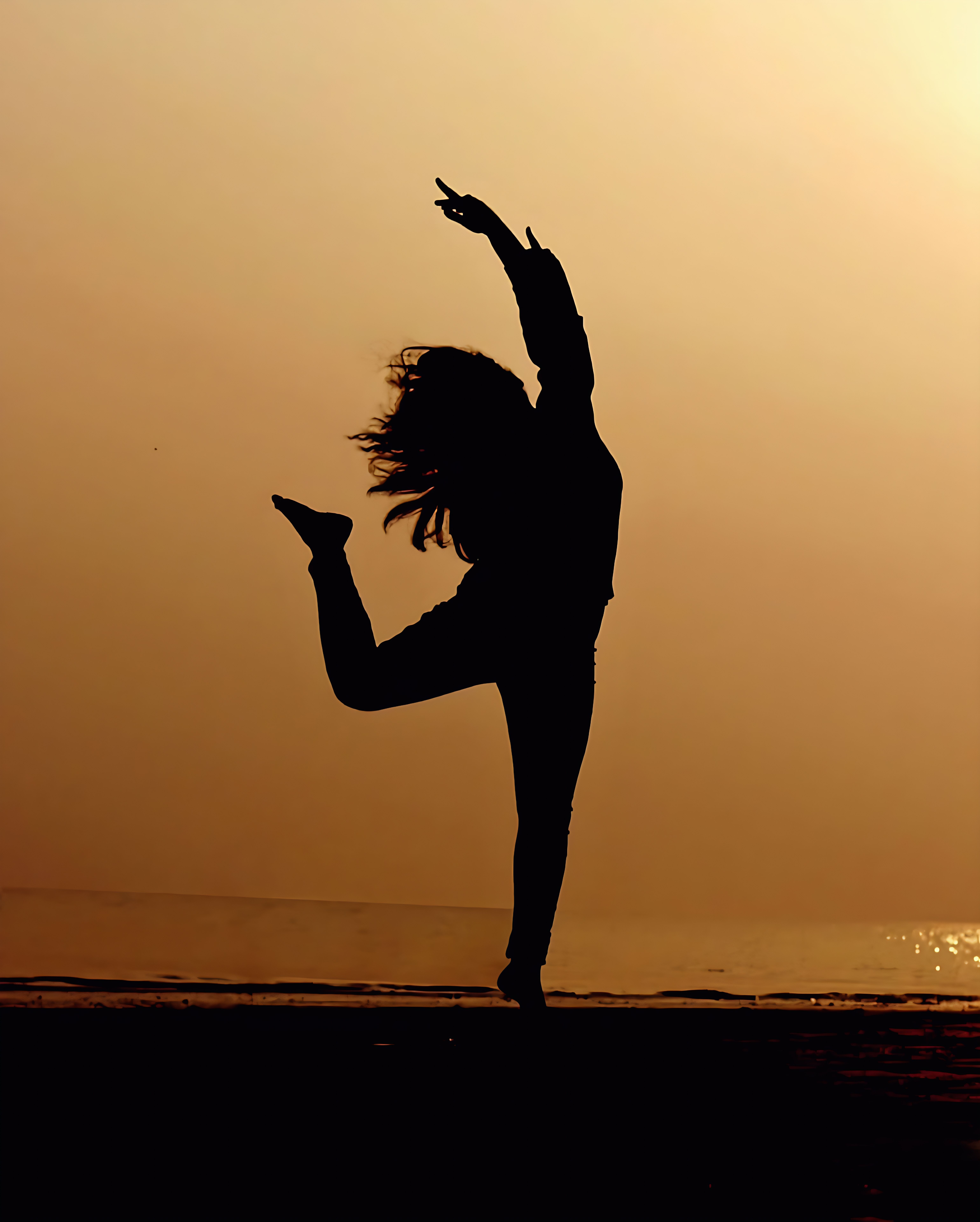 Silhouette of a dancer at sunset