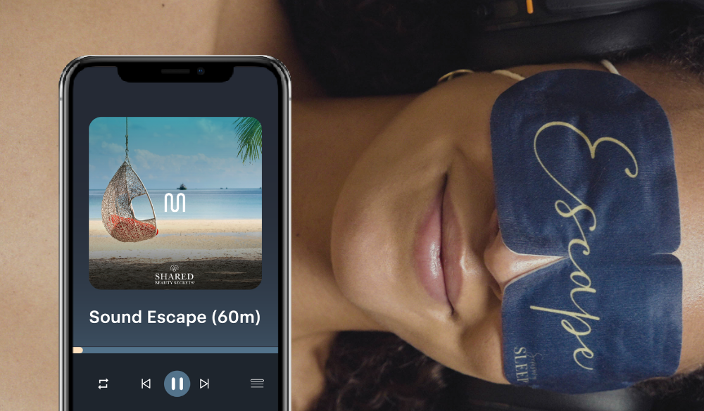 Sound Escape treatment on a phone beside a client wearing an eye mask